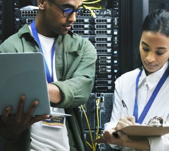 Two Gen Z workers in a server room