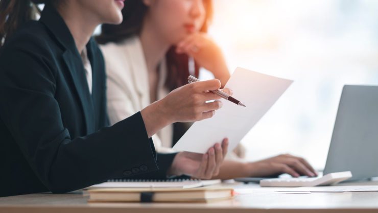 Two women saving money on job advertising