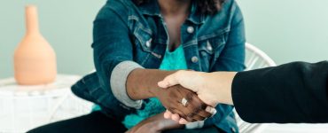 two people shaking hands