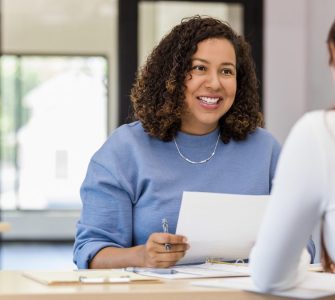 A woman interviewing another woman