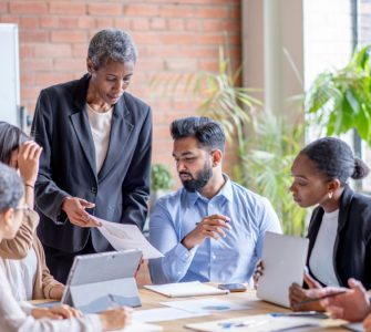 People sitting around a conference table discussing change