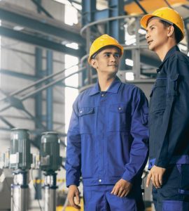 two men in a manufacturing facility