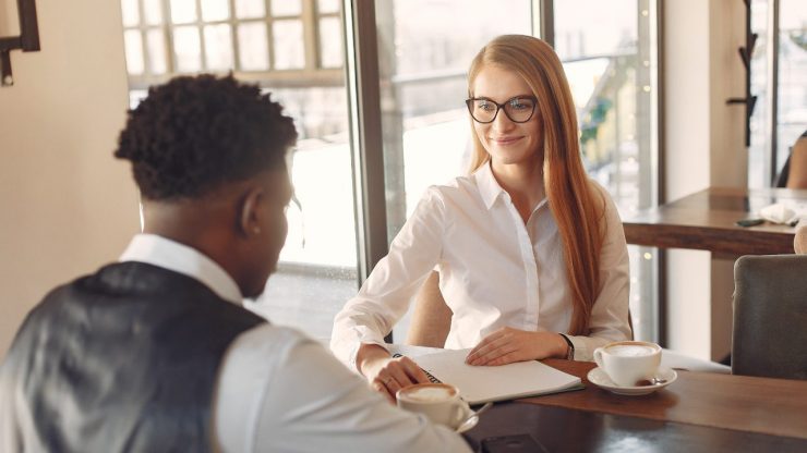 Job applicant being asked behavioral interview questions by an interviewer